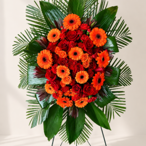 funeral spray. orange & red.