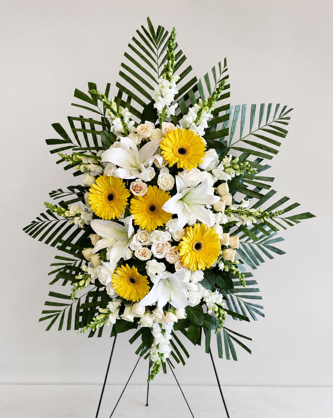 img_5342 deepest sympathies white and yellow standing spray