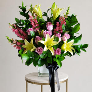 funeral sympathies pink & yellow arrangement